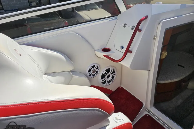 Slide: The Image of Interior of 2007 Fountain 35 Lightning boat with white and red seating, speakers, and storage. - 55