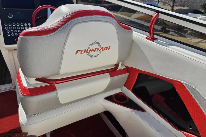 Slide: The Image of 2007 Fountain 35 Lightning boat interior with red and white seating and dashboard. - 60