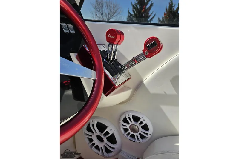 Slide: The Image of Interior of a 2007 Fountain 35 Lightning boat with red steering wheel and controls. - 67