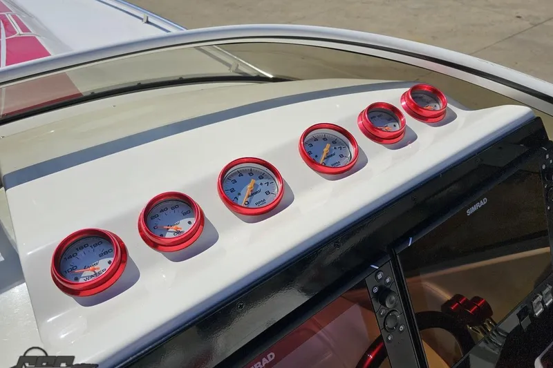 Slide: The Image of Dashboard of 2007 Fountain 35 Lightning boat with red-rimmed gauges. - 68