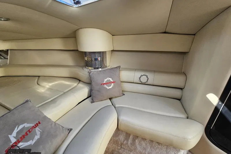 Slide: The Image of 2007 Fountain 35 Lightning interior with beige seating and branded cushions. - 76