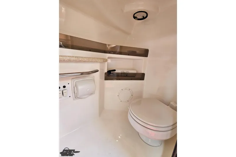 Slide: The Image of 2007 Fountain 35 Lightning boat interior bathroom with toilet and storage shelves. - 78