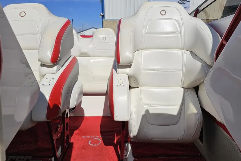 Slide: The Image of Luxurious white and red seating in a 2007 Fountain 35 Lightning boat interior. - 83