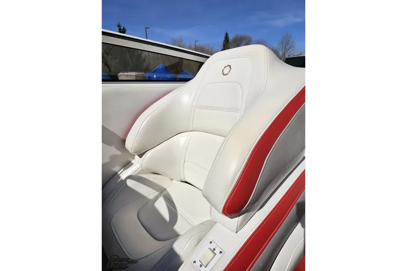 Slide: The Image of White and red seat of a 2007 Fountain 35 Lightning boat under clear blue sky. - 86