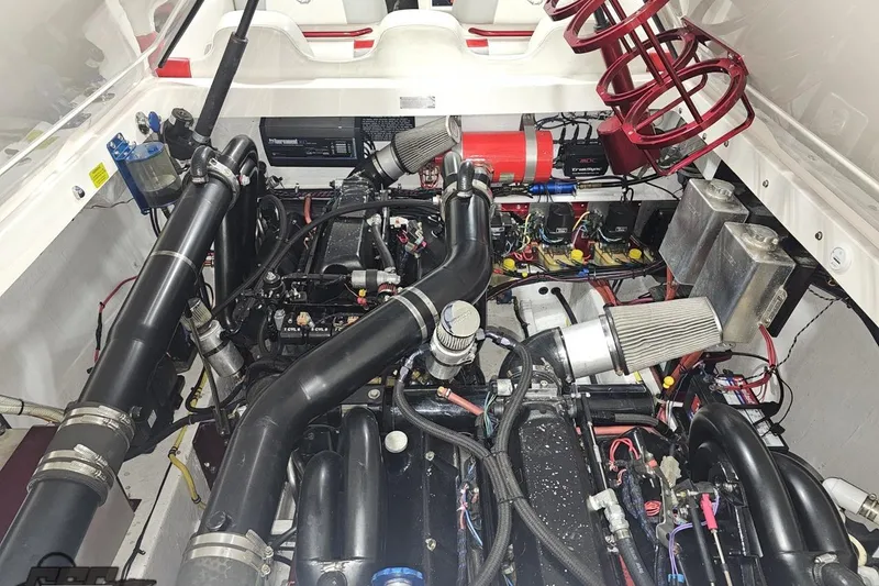 Slide: The Image of Engine compartment of a 2007 Fountain 35 Lightning boat, showcasing complex mechanical components. - 90