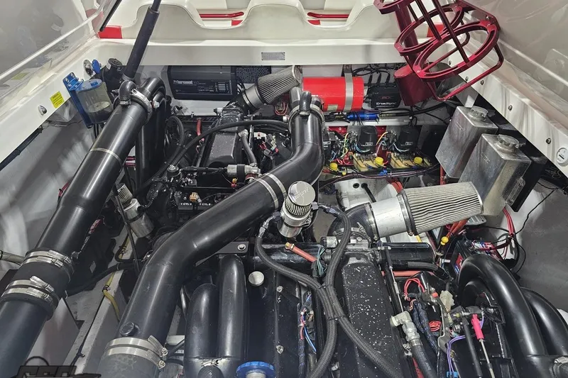 Slide: The Image of Engine compartment of a 2007 Fountain 35 Lightning boat, showcasing complex machinery and components. - 91