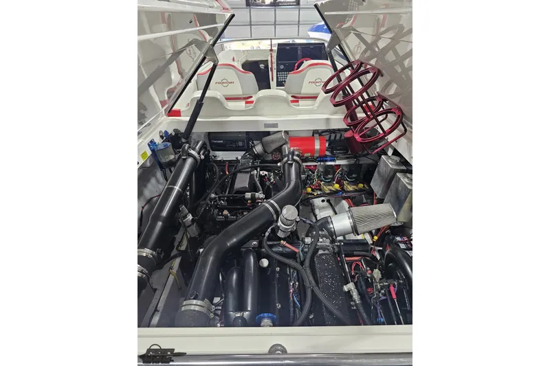 Slide: The Image of Engine compartment of a 2007 Fountain 35 Lightning boat, showcasing detailed mechanical components. - 92