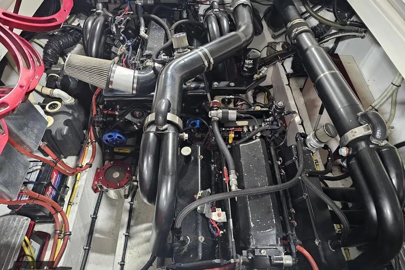 Slide: The Image of Engine compartment of a 2007 Fountain 35 Lightning boat, showcasing complex machinery and components. - 93