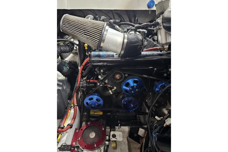 Slide: The Image of Engine compartment of a 2007 Fountain 35 Lightning boat with visible air filter and components. - 94