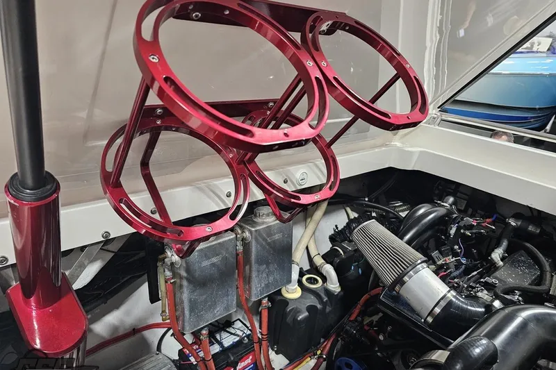 Slide: The Image of Engine compartment of a 2007 Fountain 35 Lightning boat with red components. - 95