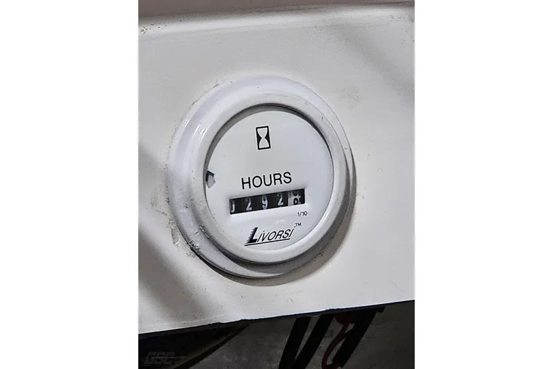 Slide: The Image of Hour meter on 2007 Fountain 35 Lightning boat dashboard, displaying 294.8 hours. - 96