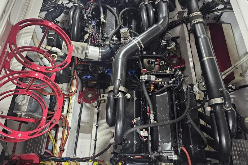 Slide: The Image of Engine compartment of a 2007 Fountain 35 Lightning boat, showcasing intricate mechanical components. - 97