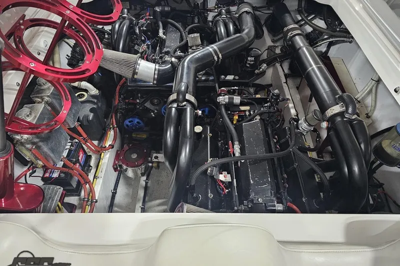 Slide: The Image of Engine compartment of a 2007 Fountain 35 Lightning boat, showcasing complex machinery and components. - 98