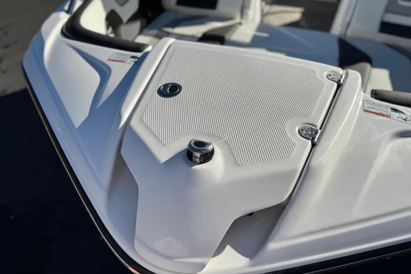 Slide: The Image of 2022 Yamaha Boats 212SE bow detail with sleek design and textured surface. - 11