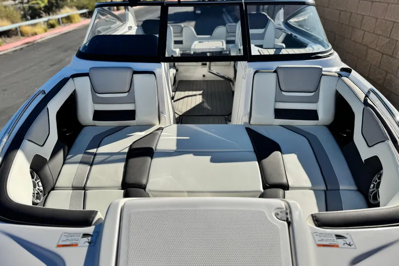Slide: The Image of 2022 Yamaha Boats 212SE interior with sleek seating and modern design. - 13
