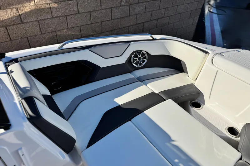 Slide: The Image of 2022 Yamaha Boats 212SE interior seating with sleek design and integrated speaker system. - 15