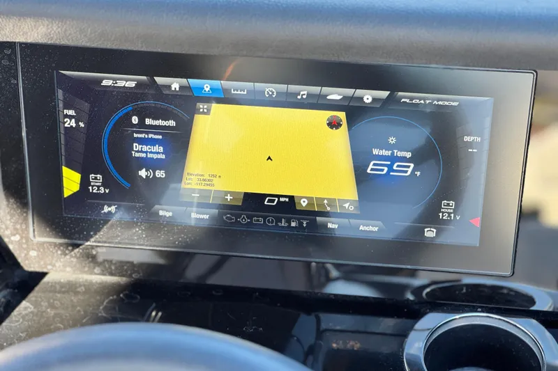 Slide: The Image of Dashboard of a 2022 Yamaha Boats 212SE displaying navigation and audio controls. - 29