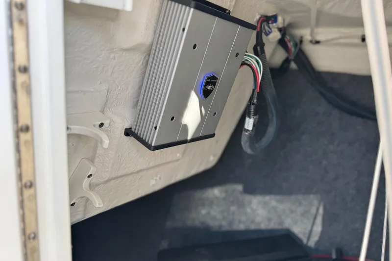 Slide: The Image of 2022 Yamaha Boats 212SE interior showing installed electronic component and wiring. - 33