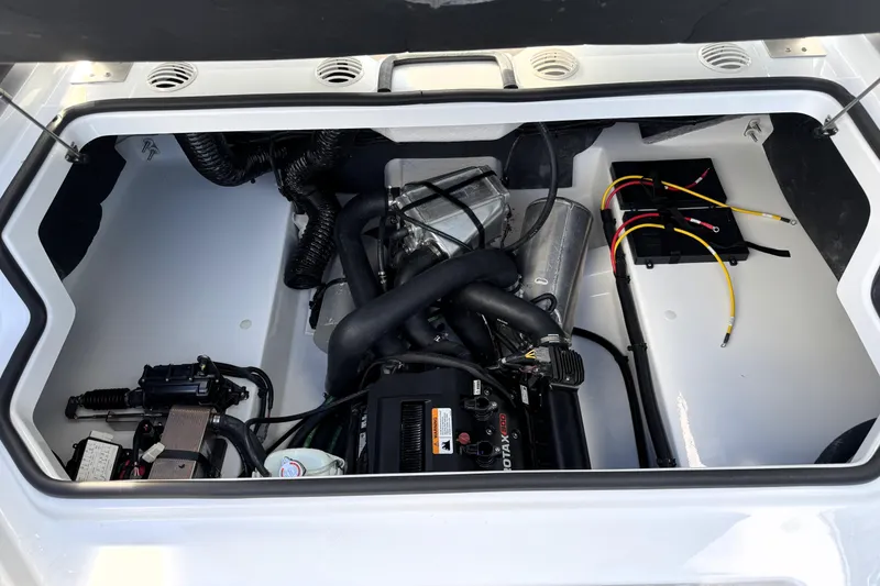 Slide: The Image of Engine compartment of 2026 Scarab 210 LX boat, showcasing Rotax engine and wiring. - 10