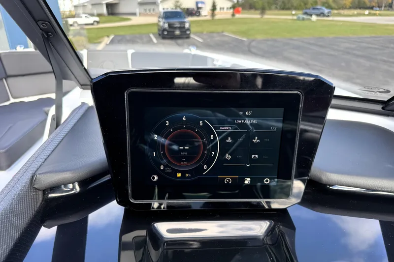 Slide: The Image of Touchscreen dashboard of 2026 Scarab 210 LX boat displaying gauges and controls. - 14