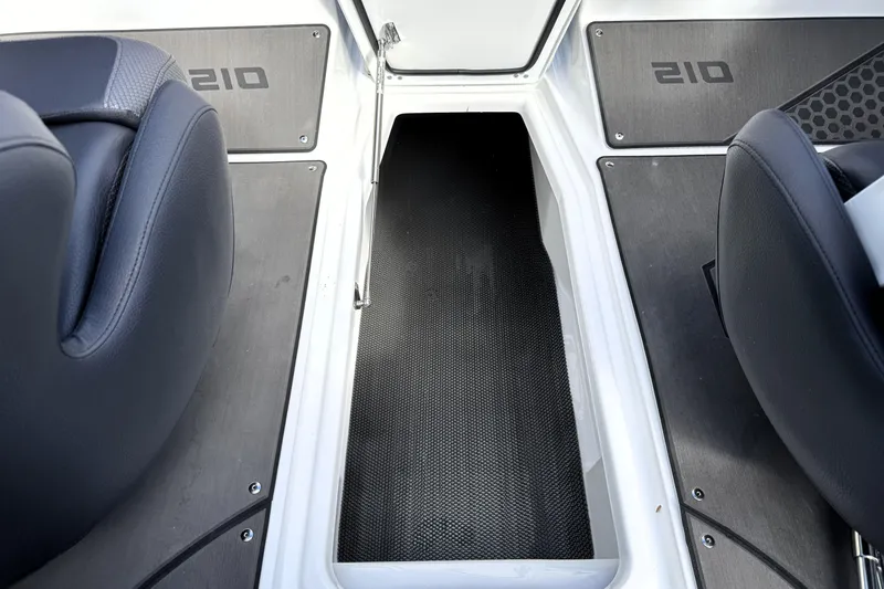 Slide: The Image of Interior view of 2026 Scarab 210 LX boat, featuring sleek seating and flooring. - 23