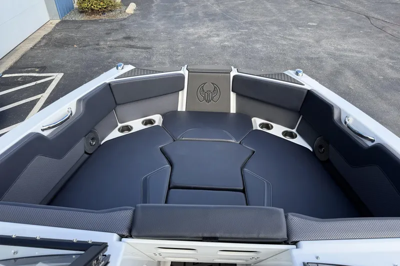 Slide: The Image of 2026 Scarab 210 LX boat interior with sleek black seating and modern design. - 31