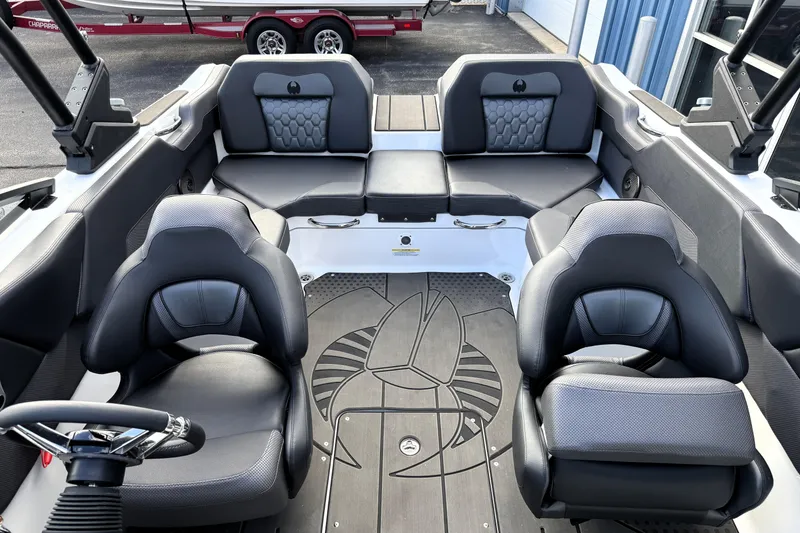 Slide: The Image of Interior of 2026 Scarab 210 LX boat with modern seating and sleek design. - 34