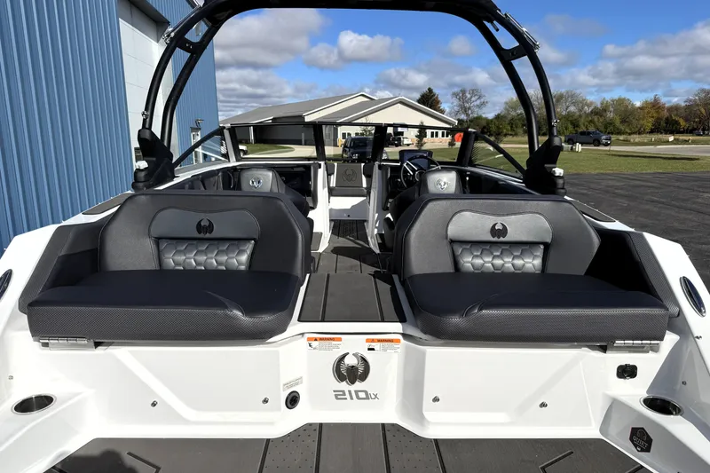 Slide: The Image of 2026 Scarab 210 LX boat interior with sleek seating and modern design. - 6