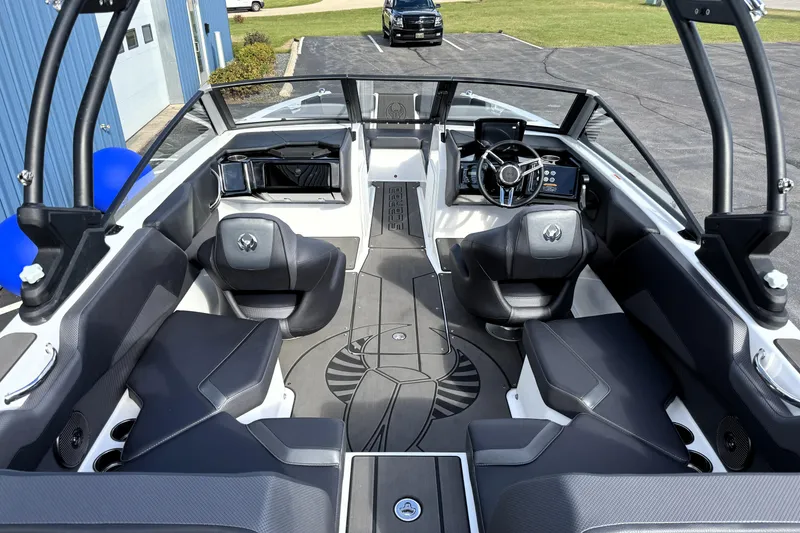 Slide: The Image of 2026 Scarab 210 LX boat interior with modern seating and sleek dashboard design. - 7