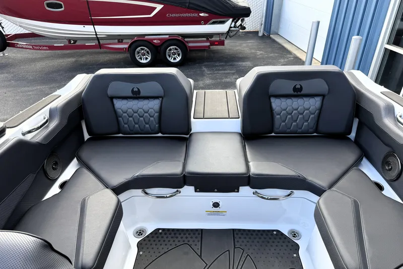Slide: The Image of 2026 Scarab 210 LX boat interior with sleek black seating and modern design. - 9