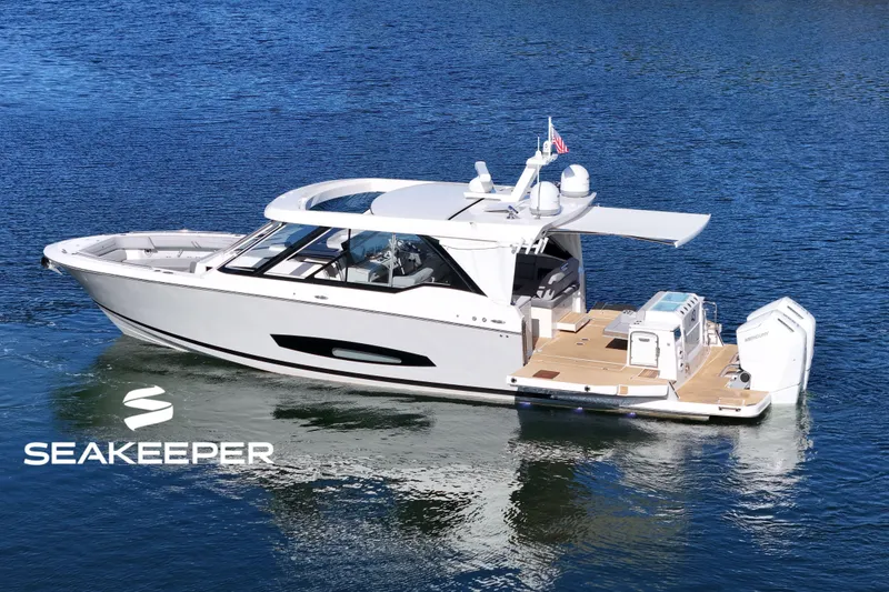The Image of 2025 Regal LX43 boat on water, featuring sleek design and modern amenities. - 0