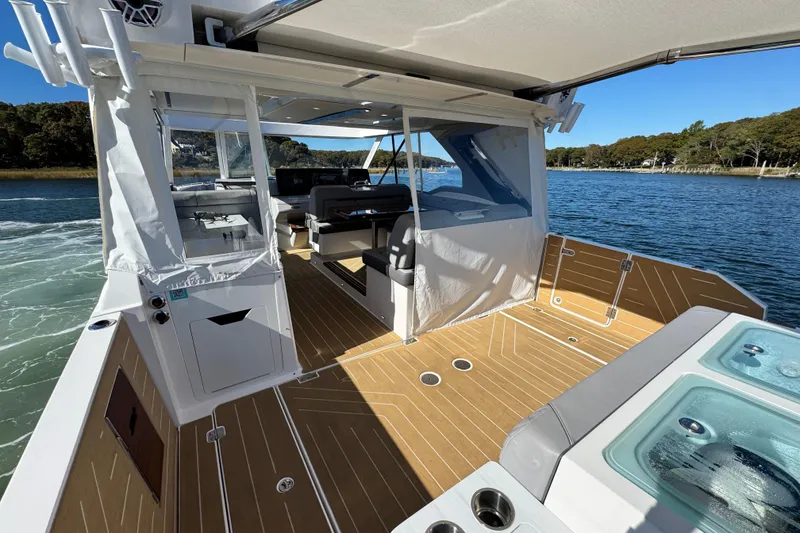 Slide: The Image of Luxury Regal LX43 boat interior, 2025 model, featuring spacious deck and modern amenities on the water. - 20