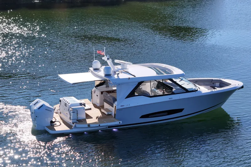 Slide: The Image of 2025 Regal LX43 luxury boat cruising on sparkling water. - 3