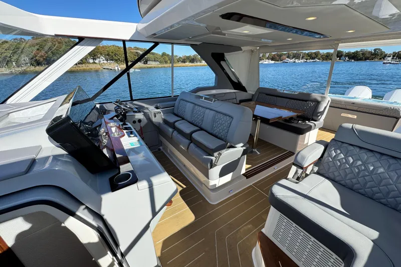 Slide: The Image of Luxurious interior of 2025 Regal LX43 yacht with plush seating and scenic water view. - 42