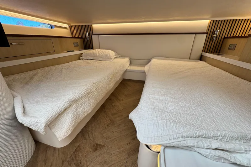 Slide: The Image of Luxurious 2025 Regal LX43 cabin interior with twin beds and modern design. - 50