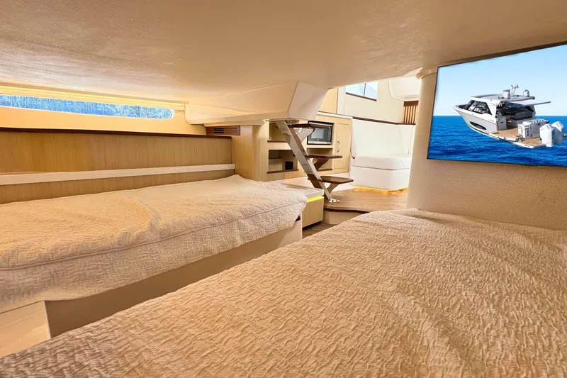Slide: The Image of Interior of 2025 Regal LX43 yacht with cozy beds and modern amenities. - 52
