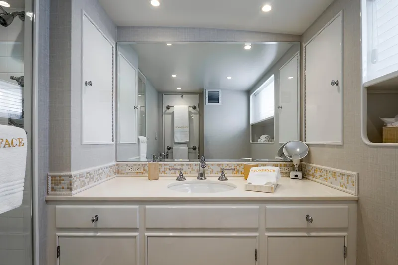 Slide: The Image of Luxurious bathroom in a 1978 custom Burger yacht, featuring elegant fixtures and ample storage. - 22