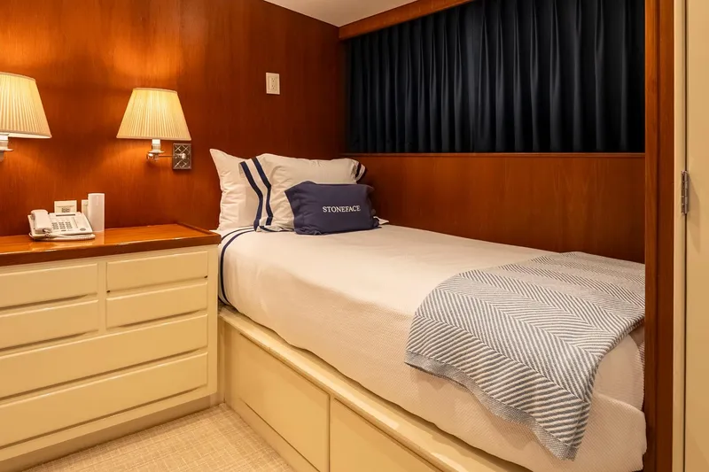 Slide: The Image of Cozy yacht bedroom with wood paneling, single bed, and soft lighting, 1978 Burger Custom. - 32