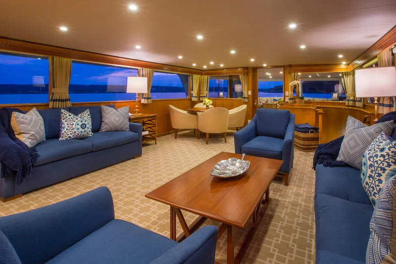 Slide: The Image of Luxurious 1978 Burger Custom yacht interior with elegant dining setup and panoramic water views. - 4