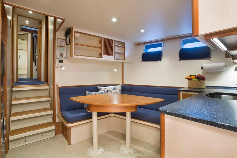 Slide: The Image of Interior of a 1978 custom Burger yacht with cozy dining area and modern kitchen. - 42