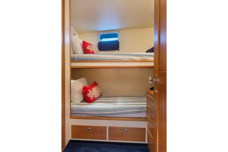 Slide: The Image of Bunk beds in a 1978 Burger Custom yacht cabin with nautical-themed decor. - 46