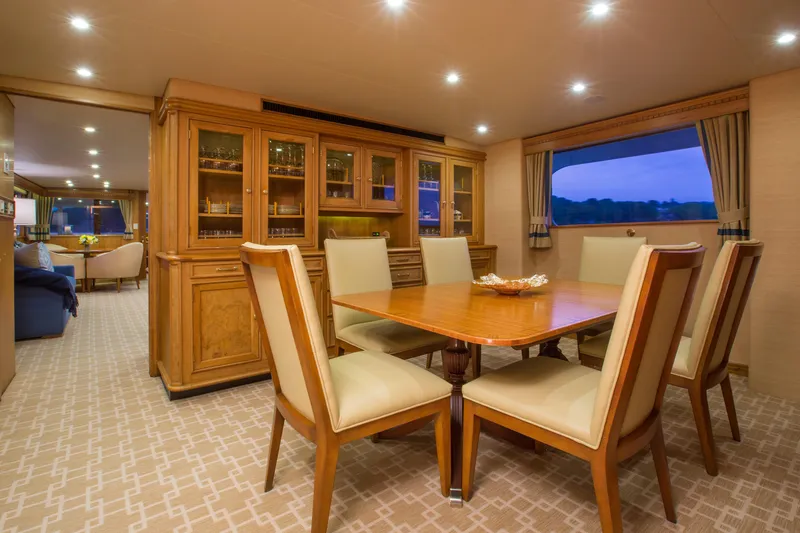 Slide: The Image of Luxurious 1978 Burger Custom yacht interior with elegant seating and dining area. - 5