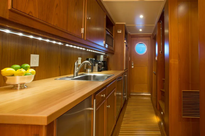 Slide: The Image of Luxurious yacht interior with elegant seating, wood paneling, and large windows, 1978 Burger Custom model. - 6