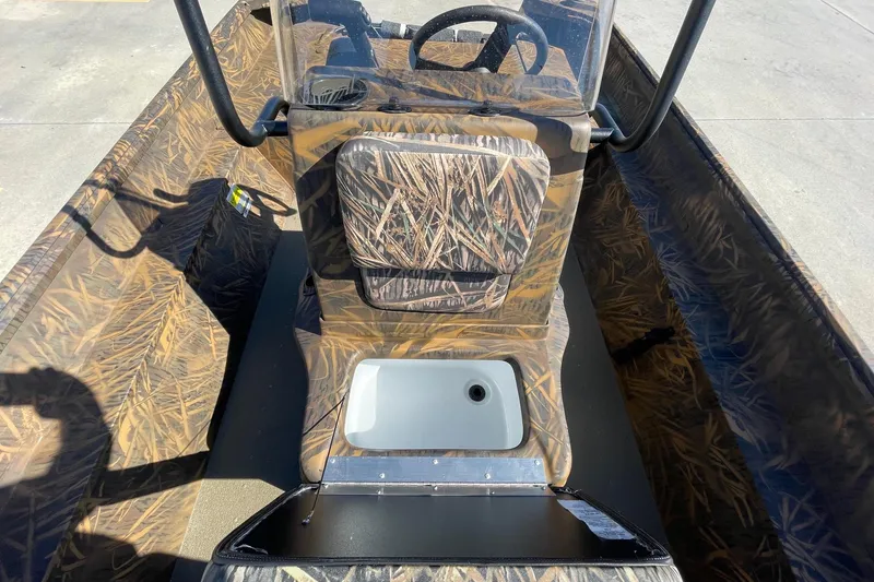 Slide: The Image of 2026 G3 Gator Tough 17 CC boat interior with camouflage design and steering console. - 12