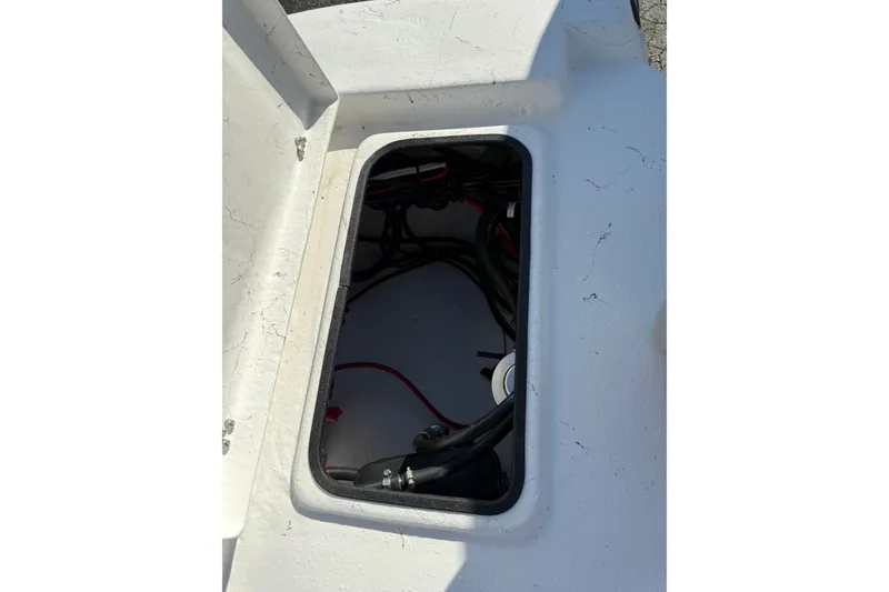 Slide: The Image of Open compartment of 2026 Blazer Bay 2400 boat showing internal wiring. - 13
