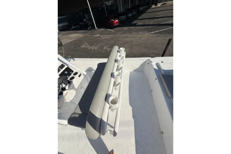 Slide: The Image of 2026 Blazer Bay 2400 boat interior with rod holders and seating. - 19