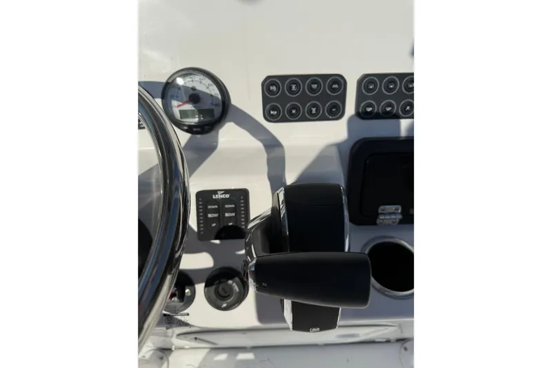 Slide: The Image of 2026 Blazer Bay 2400 boat dashboard with controls and gauges. - 23