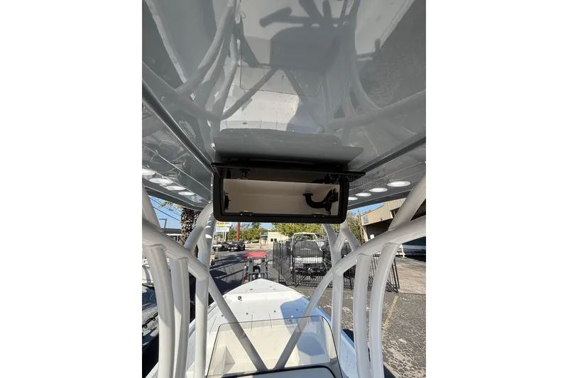 Slide: The Image of 2026 Blazer Bay 2400 boat interior view with overhead storage compartment. - 25