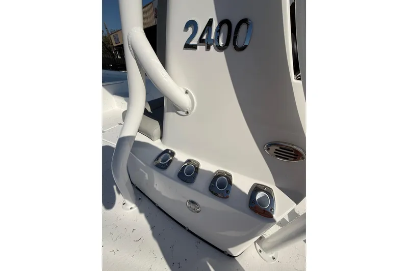Slide: The Image of 2026 Blazer Bay 2400 boat detail with sleek white design and chrome accents. - 26