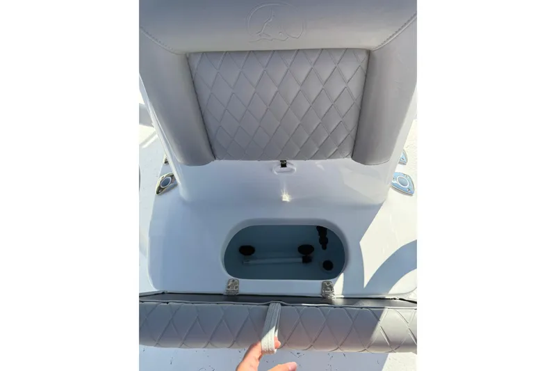 Slide: The Image of 2026 Blazer Bay 2400 boat seat with storage compartment, featuring diamond-patterned upholstery. - 30